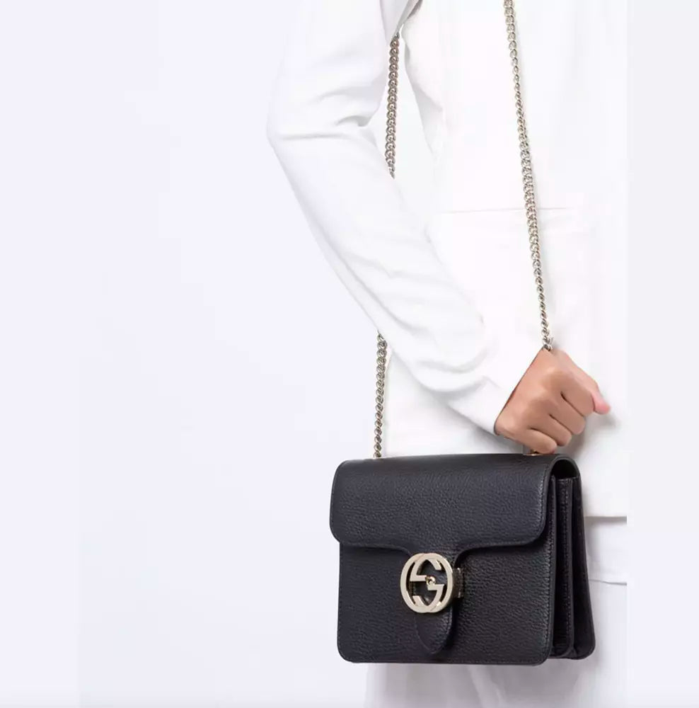 Elegant Black Leather Shoulder Bag with Silver Charm